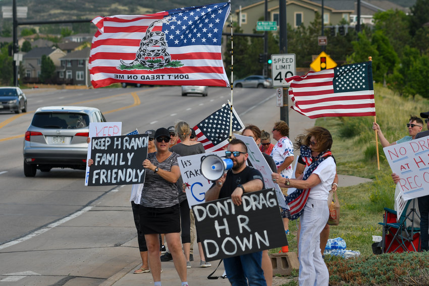 JUNE 17, 2022 - Protesters gather on a corner near the Southridge Recreation Center in Highlands Ranch holding signs in protest of a drag queen show that was held at the rec. center. The show was hosted by Comedians in Drag, Denver&rsquo;s top drag queens who entertain with their comedy and musical performances. The event was sold out. (Photo by John Leyba/Special to the Colorado Sun)