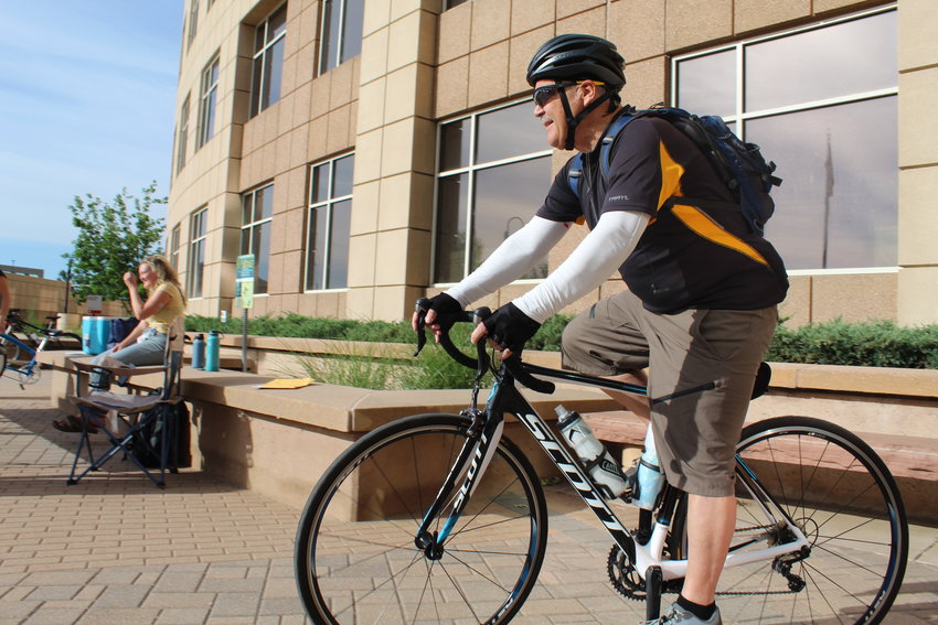 Bob Christensen, a Lakewood resident and part-time Jeffco employee, heads to his office from the Bike to Work Day station at the Jeffco Government Center on June 22.
