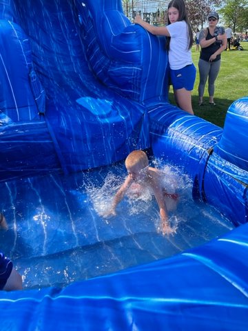Six-year-old Max Turek has the right idea on a warm July 2 .. ride a water slide at the city of Fort Lupton's annual July 4 party at the Fort Lupton Recreation Center. In addition to the water slide, there was face painting, bounce houses, skeeball, music (including a set from Fort Lupton native Kimi Most), plenty of food and fireworks.