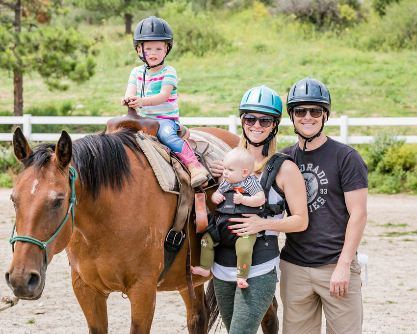 The Harrison family rides horses in August 2017 during a family camp offered by the Staenberg-Loup Jewish Community Center. The JCC Denver is celebrating its 100th anniversary this year.