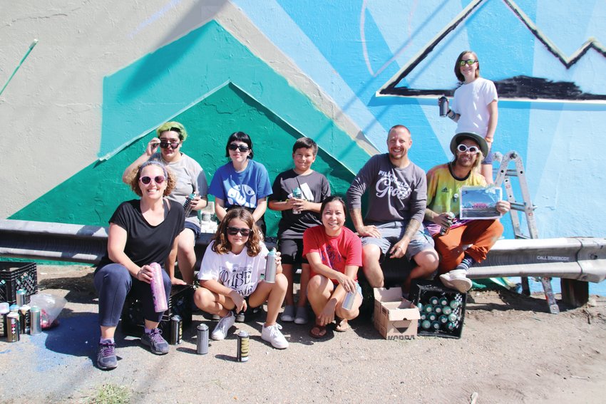 A group of teens with Rise Above Colorado and youth mentors gather for a photo in early August as they were working on Rise Above Colorado&rsquo;s 50th capstone mural, which is located on a building at 788 S. Broadway in Denver.
