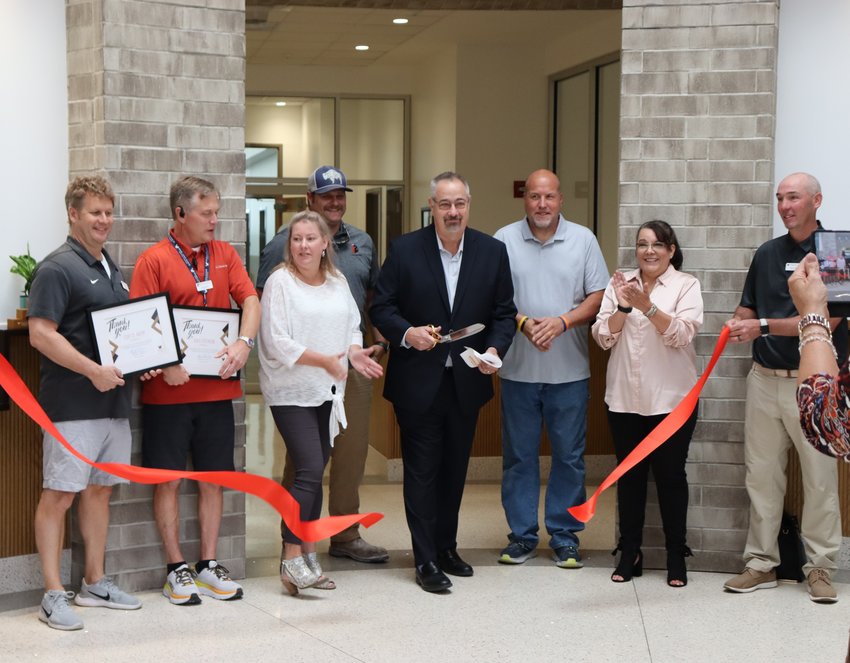 Highlands Ranch General Manager Mike Bailey cuts the ribbon on Sept. 14 at the reopening for Eastridge Recreation Center, which underwent renovations to the entrance rotunda and administrative offices this summer.