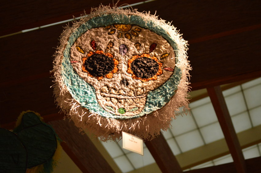 One of the pi&ntilde;atas on display in Smoky Hill Library, as of Sept. 14, is of a sugar skull.
