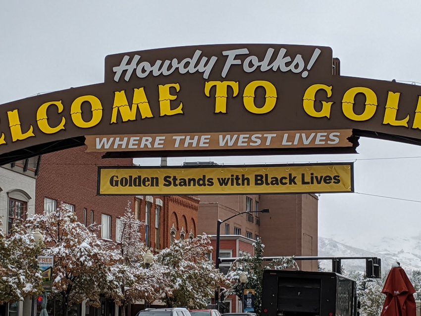 A banner reading &quot;Golden Stands with Black Lives&quot; hangs from the iconic &quot;Welcome to Golden&quot; sign over Washington Avenue in September 2020. After declaring racism as a public health crisis in 2020, among other efforts, Golden hired a consultant firm to draft a racial equity, diversity and inclusion plan, which is in its final stages and will be presented to City Council on Nov. 1.