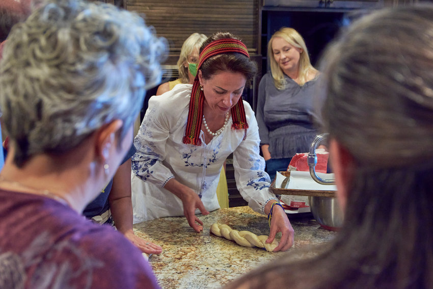 Tetiana Stratilat, a private culinary chef in Kyiv, teaches the Ukrainians of Colorado&rsquo;s cooking class how to make pletinka with poppy seeds &mdash; a braided bread.