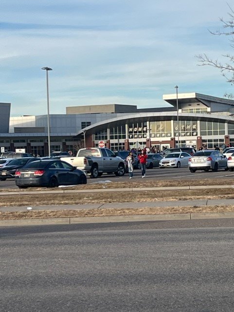 Students leave Prairie View High School Dec. 1 after an hour-long lockdown. Police arrested three juveniles and recovered a handgun from a student's car.