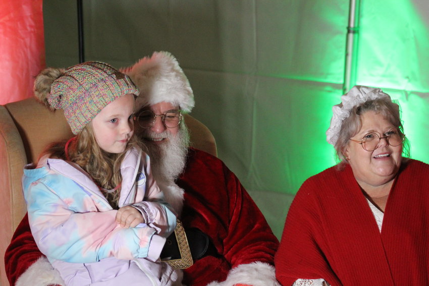 Five-year-old Charlotte Rowland is about to deliver her Christmas wish list to Santa and Mrs Claus at the city of Brighton's tree-lighting program Dec. 3 at Founders Plaza. After repairs to a breaker, Mayor Greg Mills lit the Christmas tree, signifying the beginning of the holiday season.