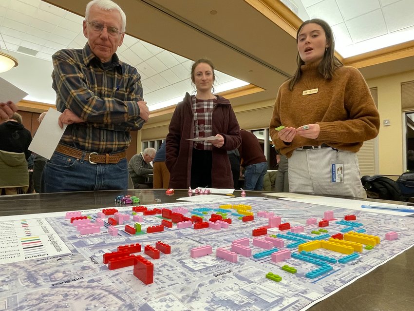 Participants at Golden's Jan. 31 &quot;Howdy Downtown&quot; community meeting play a parking game to examine the city's current predicament and possible management strategies. Red and pink Legos represented overused parking areas, green was average, and yellow and blue was underused.