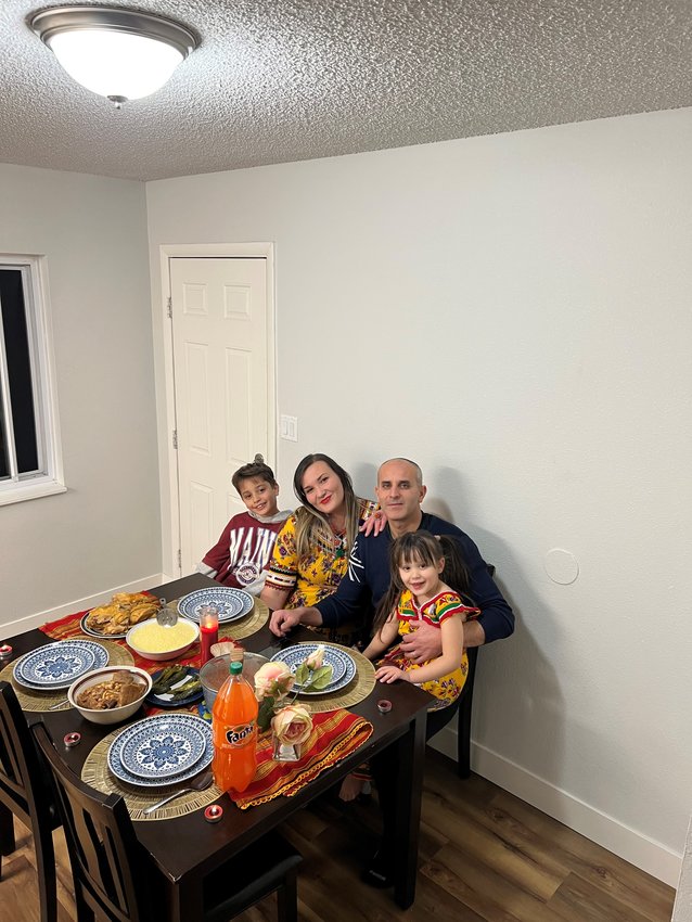 Aldjia Oudachene and, her husband, Idir Ouarab, pose with their children, Yacine and Anais, at their home in Littleton. Originally from Algeria, Oudachene applied to Habitat for Humanity Metro Denver for a home in Littleton, where average home prices have gone up $300,000 between 2017 and 2022.
