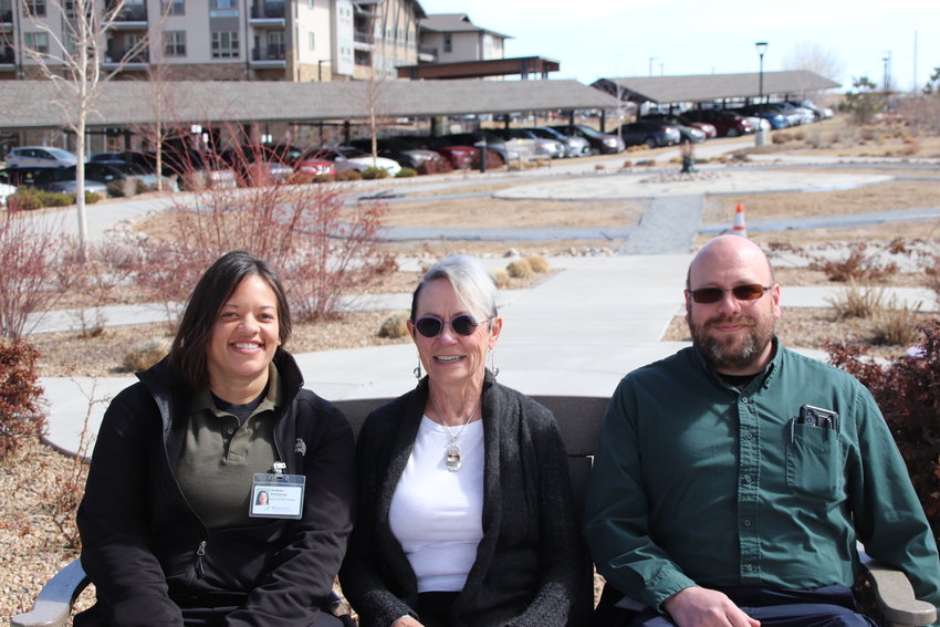 Wind Crest Senior Facilities Director Andrea Simmons, resident Sara Jo Light and Grounds Supervisor Andrew Thomas sit in front of the future pollinator garden at Wind Crest in Highlands Ranch. The garden is part of a larger project at Wind Crest to reduce outdoor watering.