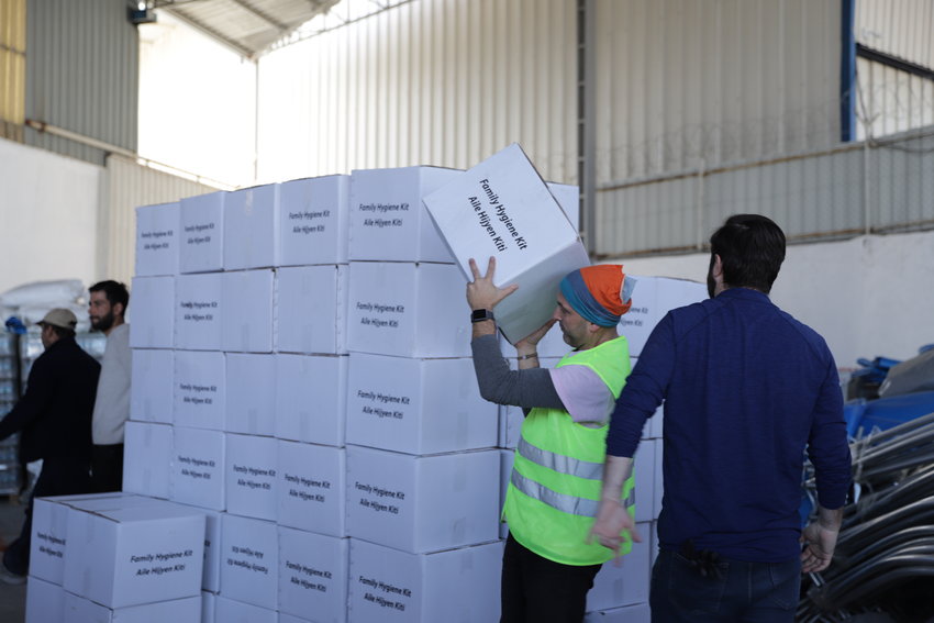 A ShelterBox worker distributes aid in Turkey.