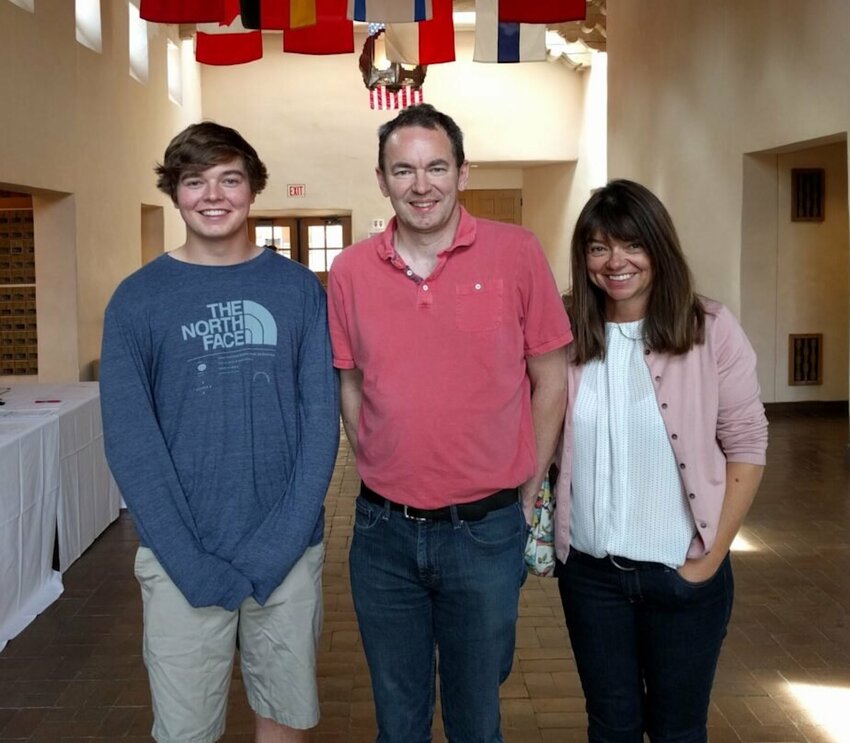Christian Glass, left, with his parents Simon and Sally.