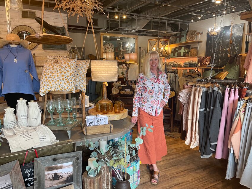 Diana Dargen stands in her store, Sisters & Company, in
downtown Evergreen.