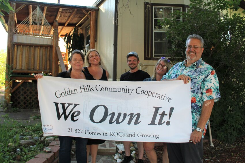The Golden Hills Mobile Home Park co-op board members hold a new sign celebrating their resident-owned community status. From left, the board members are: Joyce Tanner, Valerie Dillon, Will Gregg, Sally Burton and Art Erwin.