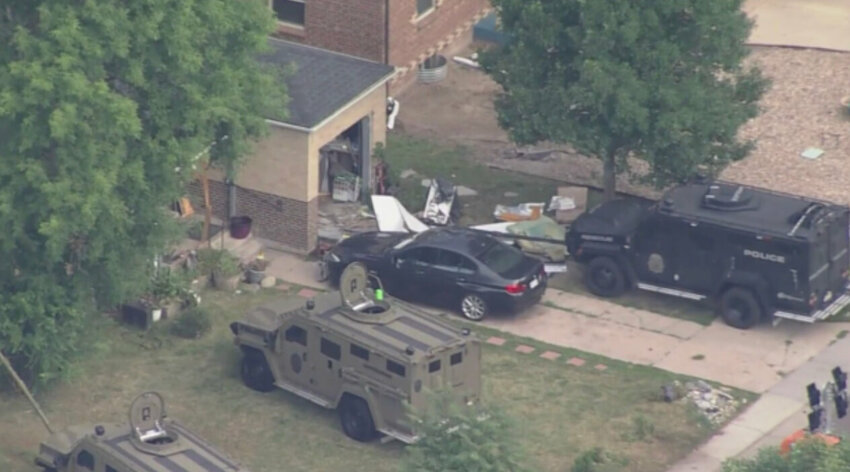A July 18 standoff at a home in Englewood ended when police shot a suspect.