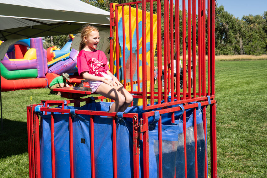 Kayla TeBockhorst sits in the dunk tank chair Sept. 9 awaiting the first throw. It was part of the celebration of her Dad, a popular teacher at Westminster's Betty Adams Elementary.