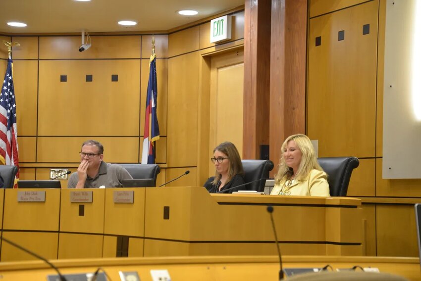 (L to R) Councilmembers John Diak, Brandi Wilks and Laura Hefta listen to a presentation at a town council meeting.