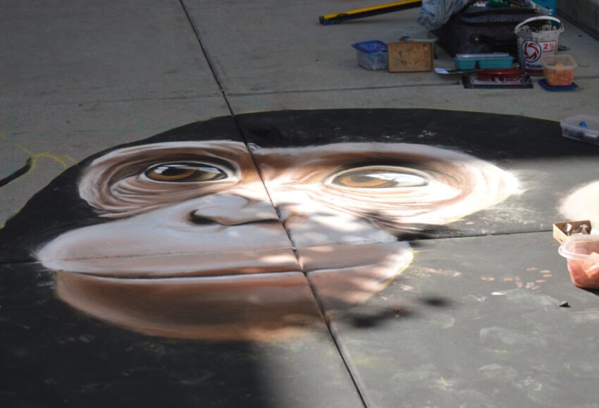 One of the chalk art pieces at the 2023 Centennial Chalk Art Festival was of a monkey&rsquo;s face, created by artist Noreen Schroder.