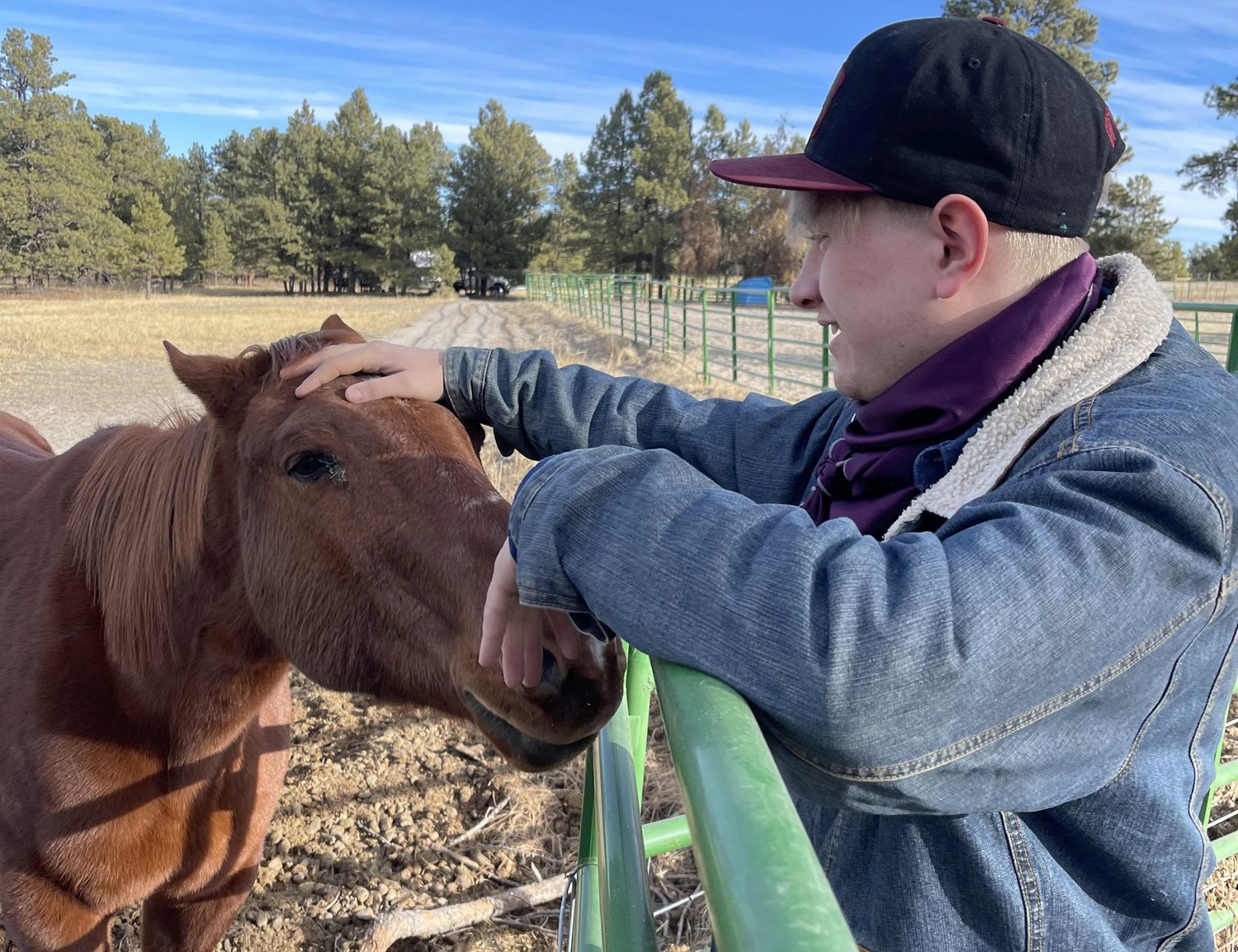 Brian Gillen stands with his family's 25-year-old horse, Thumper. Thumper was the horse Gillen rode from the days when he was a 12-year-old boy until his freshman year of college. Gillen is part of the West Texas A&amp;M University Rodeo Team and hopes to become a professional rodeo cowboy.