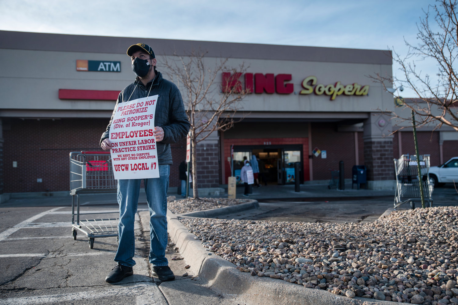 Justin Presser, a King Soopers employee since 2006, strikes on Wednesday in Denver.