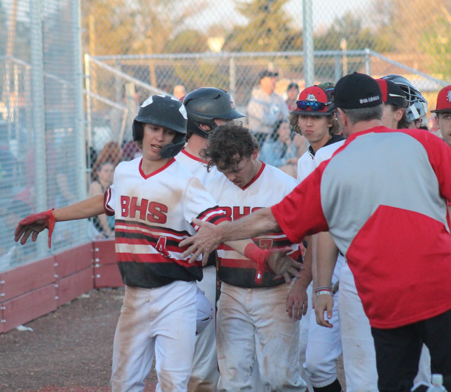 Brighton's Brendan Strait (4) gets the handshakes after his two-run double in the fourth inning gave Brighton an eventual 3-2 win over Vista Peak and the last Eastern Metro Athletic Conference regular season championship.    Photos by Steve Smith
