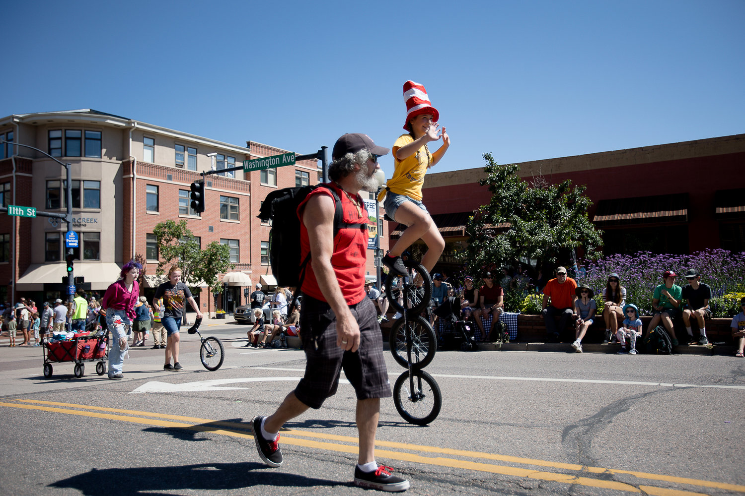 Members of the Welchester Circus Arts Club ride through on different unicycles during &quot;The Best of the West&quot; Parade on July 30 in downtown Golden.