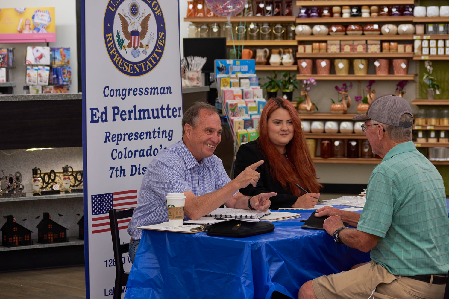 Buzzy Mann speaks with Congressman Ed Perlmutter at his final Government in the Grocery event.