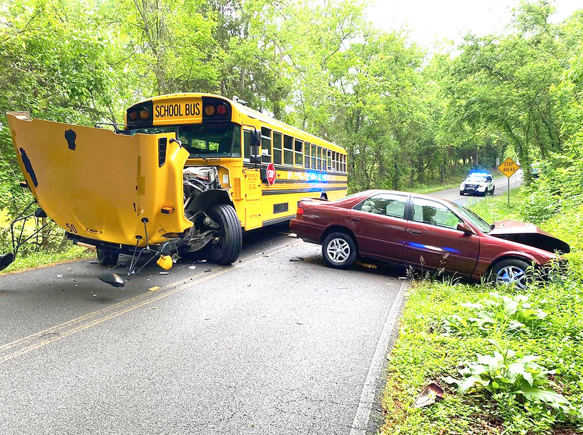 A BRADLEY COUNTY SCHOOLS bus and a sedan rest after colliding Friday morning on Holloway Road. Two Lake Forest Middle School students were transported to Tennova Healthcare - Cleveland, where they were treated for minor injuries. A child passenger in the vehicle was transported to Erlanger Hospital with &quot;non-life threatening injuries,&quot; according to Bradley County Schools Public Information Officer Brittany Cannon.