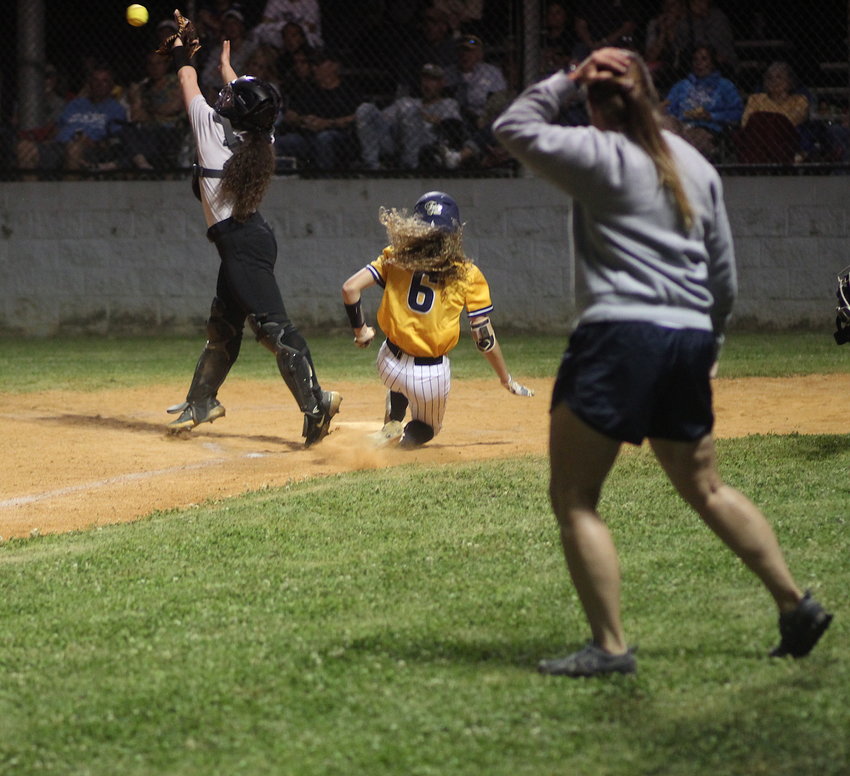 WALKER VALLEY'S Karly Blackwell slides safely into home for the first Lady Mustangs' run in the District 5-4A winner's bracket final against McMinn County Monday, in Oootewah.