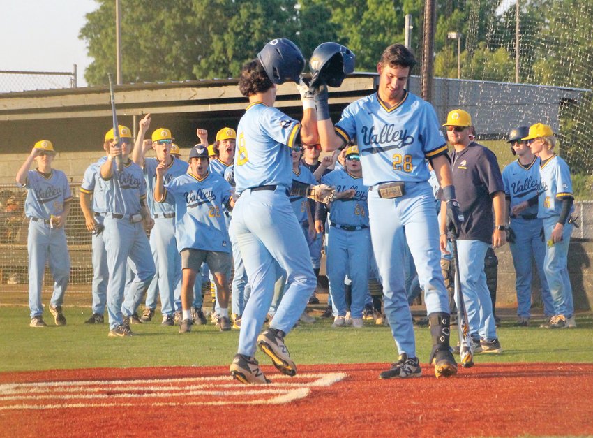 CARSON-NEWMAN signee Aiden Gibson (8) is greeted by Kentucky commit Landon Franklin (28) after blasting a home run to help Walker Valley down archrival Bradley Central 9-4 in the District 5-4A Championship Game, in Athens.
