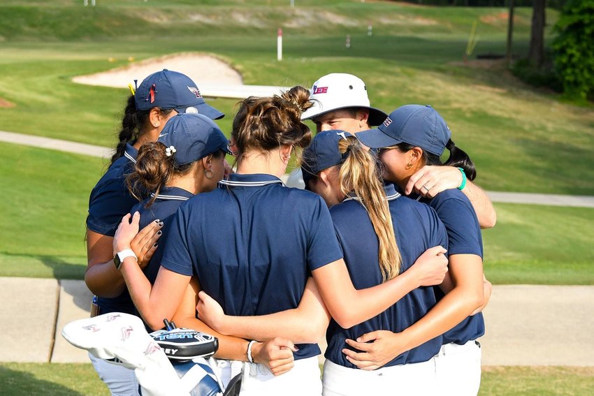 LEE UNIVERSITY'S women's golf team gather at the 18th green after a program-best finish at the NCAA D2 National Championships. The 10th-ranked Lady Flames fell 3-1-1 to No.  7 Barry (Fla.) in a quarterfinal match play at the Chattahoochee Golf Club, in Gainesville, Ga. Friday.