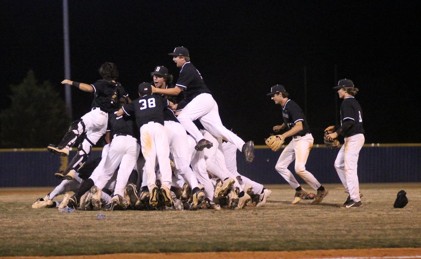 BRADLEY CENTRAL players celebrate with a dog-pile after claiming the Region 3-4A Championship Game with a 53- win over Walker Valley Wednesday evening, at Mike Turner Field.