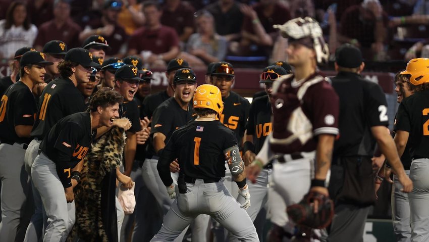 TENNESSEE JUNIOR Drew Gilbert (1) is greeted by teammates after blasting a two-run homer in the