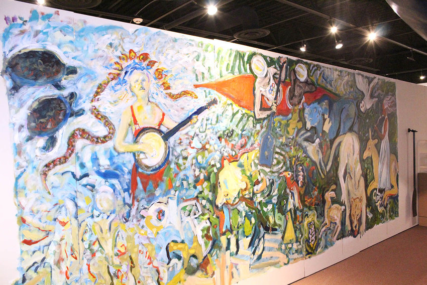 A MURAL painted by local artist Fred Wise on a wall inside the Museum Center at 5ive Points depicts a day in the life of the Ocoee River.