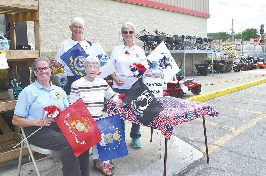 MEMBERS OF THE AMERICAN LEGION AUXILIARY Unit 81 were passing out poppies for Memorial Day on Saturday at the entrance to Tractor Supply Company on Keith Street. Seated are Mary Baier and Juanita Cooper, while standing are Martha Kazy and Janet Allen. The auxiliary also handed out poppies at the Memorial Day ceremony at the Bradley County Courthouse.