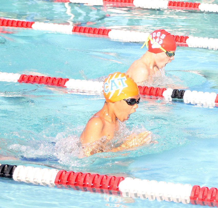 BATTLING IN the breaststroke of the Boys 11-12 relays, Elijah Bean, of the Cleveland Aqua Tigers, and Waterdog Silas Dunn are neck-and-neck, trying to give their respective teams an edge during Monday evening's CASL White Division meet, at the South Cleveland Community Center pool.