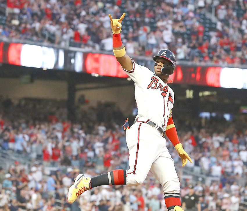 ATLANTA BRAVES outfielder Ronald Acuna reacts after hitting a 2-run homer to take a 7-6 lead over the San Francisco Giants during the fourth inning of Tuesday night's game, in Atlanta. The Giants rallied for a 12-10 victory.