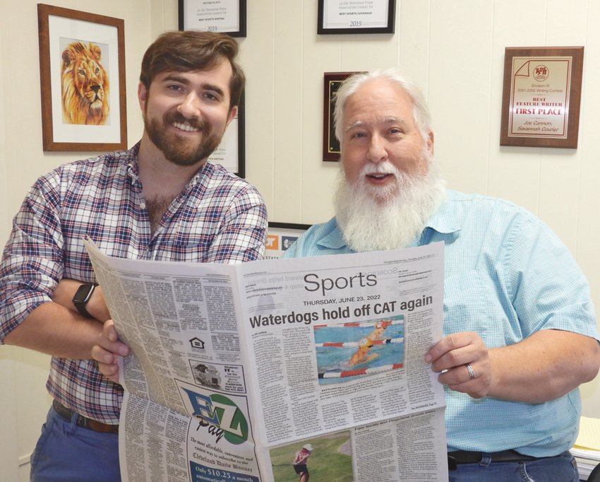 LOOKING OVER a recent layout, new sports editor Joe Cannon, right, welcomes new sports writer Matt  Tyson to the Cleveland Daily Banner staff. The duo will lead the paper's coverage of Bradley County teams and athletes for the Banner's print and website readers.