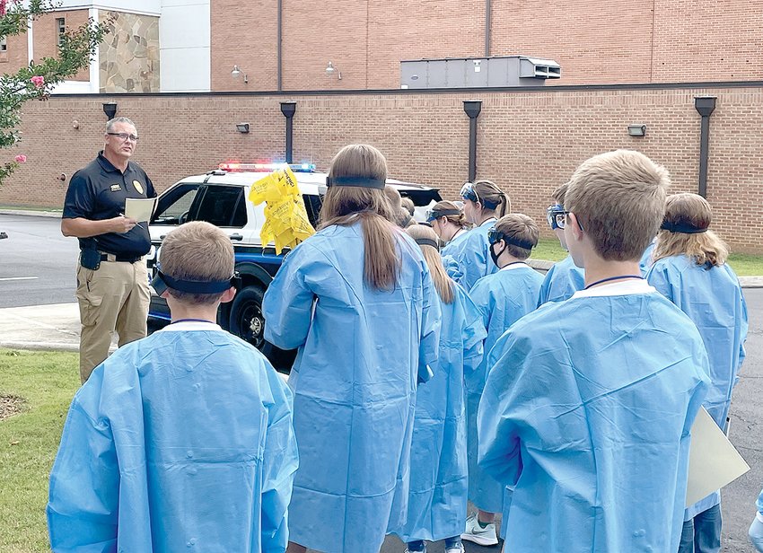 Doug Towne, with Cleveland State Community College&rsquo;s Law Enforcement Training Academy, assisted students in CSCC&rsquo;s Forensic Science STEAM Camp with a crime scene investigation on Monday, July 11. The camp offers students the opportunity to gain skills through hands-on experiences in the discovery of a crime, crime scene investigation and evidence analysis. Topics covered include evidence collection, forensic osteology (bones), fingerprint analysis, blood (synthetic) typing analysis, DNA analysis and ballistics. Participants started the week documenting and collecting evidence from a mock crime scene and setting up a CSI laboratory.