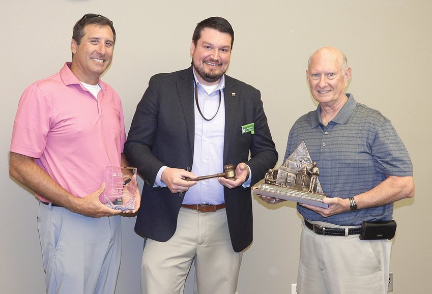 NEW BOARD CHAIR ANDREW DINSMORE is flanked by 2021-22 &quot;Volunteer of the Year&quot; Mark Gravelle (left) and &quot;Ron Braam Award&quot; recipient Ken Jones at the Junior Achievement of the Ocoee Region annual meeting held July 20.