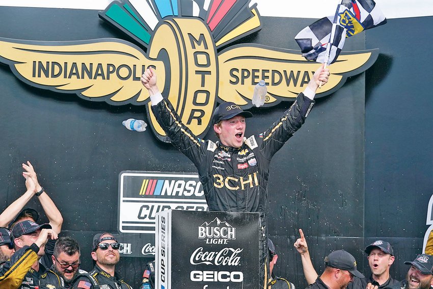 TYLER REDDICK celebrates after winning a NASCAR Cup Series race at Indianapolis Motor Speedway, Sunday, in Indianapolis.