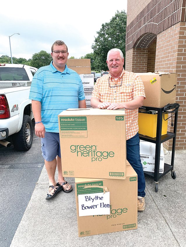 The Church at Grace Point, 2575 Old Freewill Road, Cleveland, recently donated school supplies to Blythe-Bower Elementary School. From left are Garrett Asble and Pastor Rusty Asble.
