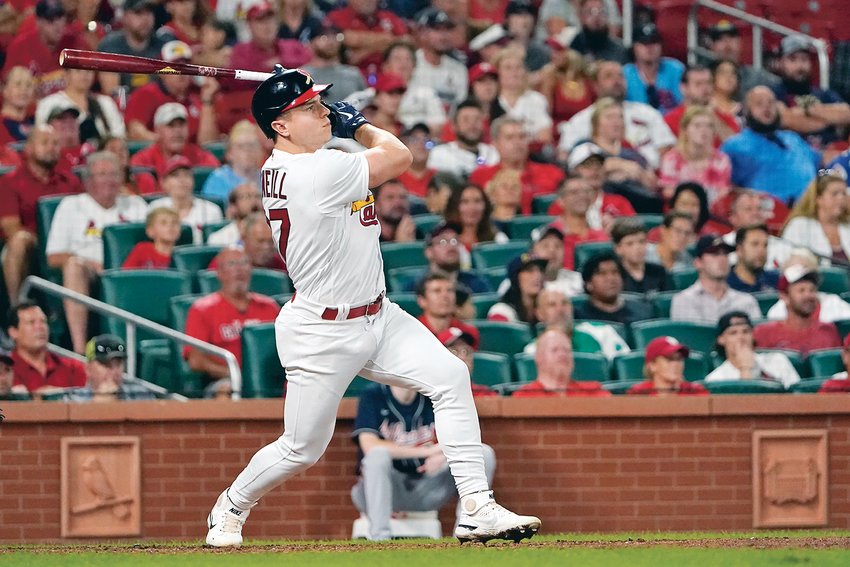 St. Louis Cardinals' Tyler O'Neill watches his three-run home run during the eighth inning of a baseball game against the Atlanta Braves Sunday, Aug. 28, 2022, in St. Louis.
