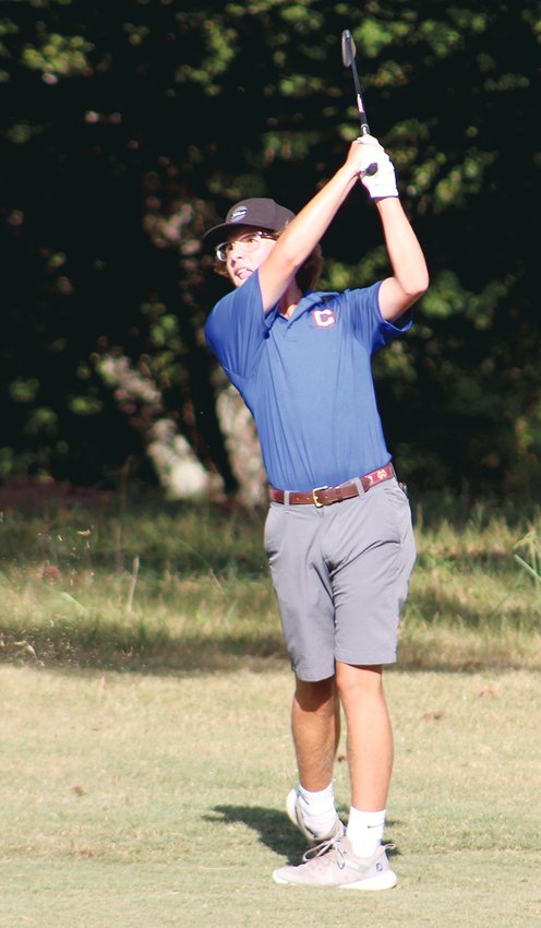CLEVELAND GOLF'S Nolan Lowden follows his fairway shot on the first hole during the Blue Raiders' match play competition against Bradley Central at Cleveland Country Club Thursday. Lowden took his matchup over the Bears' Andrew Suttles, helping Cleveland win 7-2 overall.
