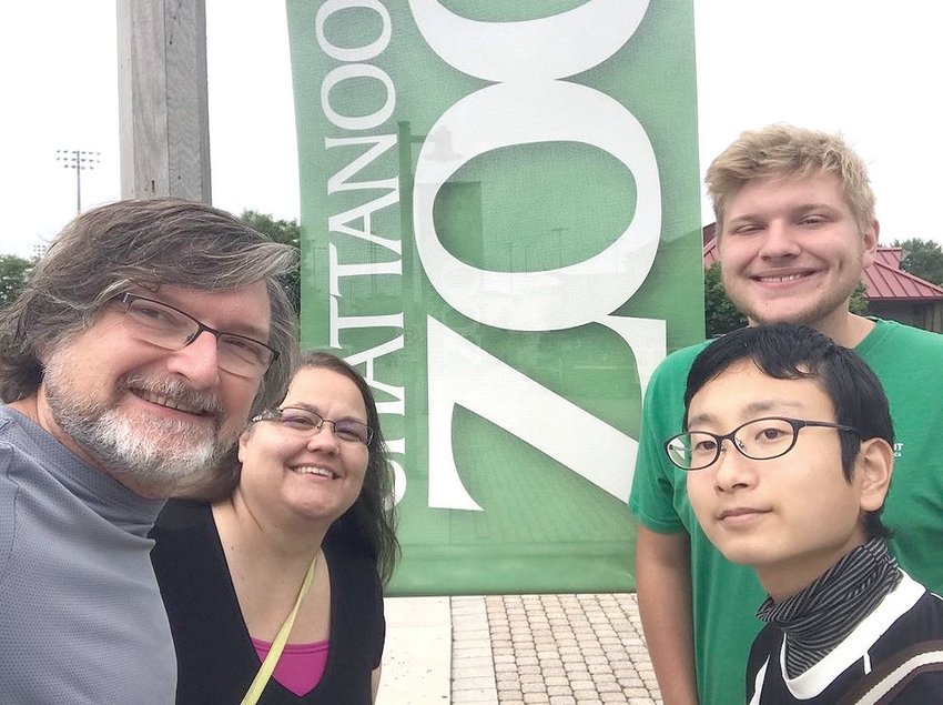 MASAHIRO OKA, lower right, a 4-H International Exchange student, was able to spend three weeks in Bradley County with the Caywood family, learning more about U.S. culture. One of the places he got to visit was the Chattanooga Zoo, with the host family's parents, Doug and Jill Caywood, and son, Xander.