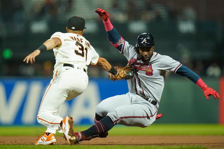 SAN FRANCISCO Giants first baseman LaMonte Wade Jr. (31) tags out Atlanta Braves' Michael Harris II, who singled, at first on the throw from center fielder Lewis Brinson during the seventh inning in San Francisco Monday.