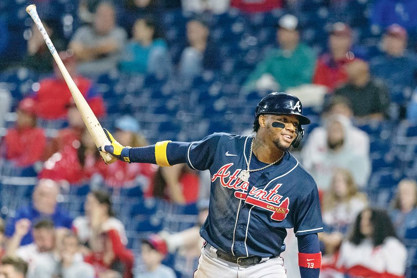 ATLANTA BRAVES' Ronald Acuna Jr. celebrates after scoring on an RBI single by Michael Harris II during the 11th inning against the Philadelphia Phillies Sunday in Philadelphia.