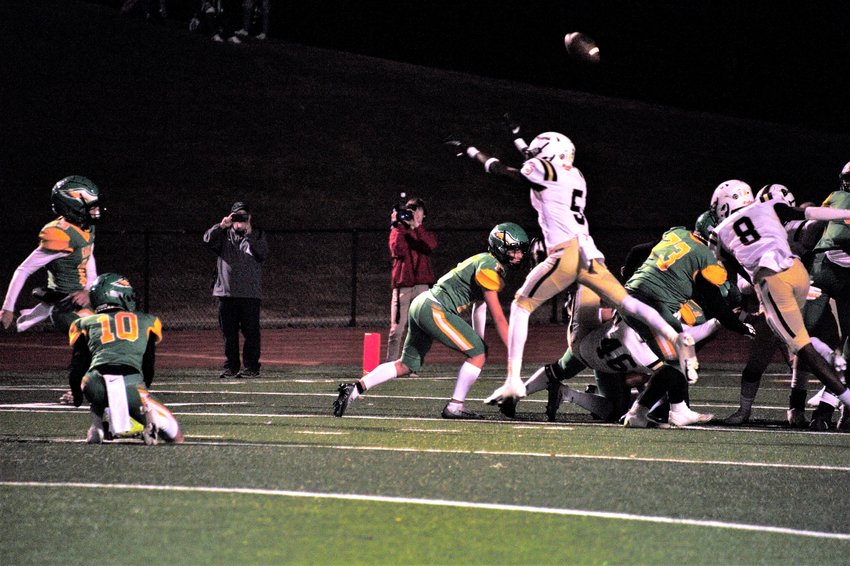 BRADLEY CENTRAL sophomore Mason Goree (5) blocks a Rhea County field goal attempt, that senior teammate Finn Mertens scooped up and returned 95 yards for a TD during Friday evening's 30-10 Bear victory, in Evensville.