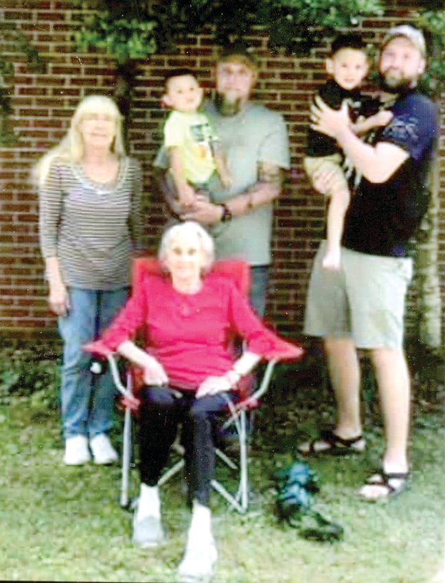 FIVE GENERATIONS of the Greene/Gee family pose for a photo. Pictured are Anna Greene, great-grandmother (seated); Rae Ella Greene Gee, great- grandmother; Matthew Gee, holding grandson, Grayson Gee; and Cody Gee, holding Wyatt Gee.