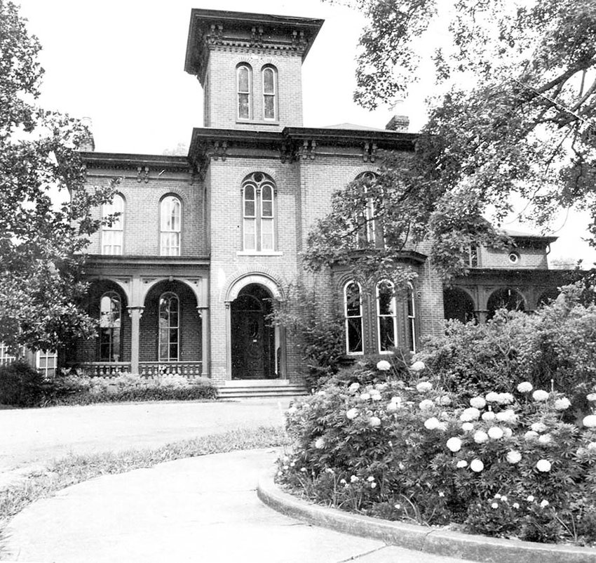 THE CLEVELAND PUBLIC LIBRARY opened on Sept. 3, 1923, with the donation of the Craigmiles House to the city in memory of Sarah Tucker Johnston. This early 1960s photograph shows the Mary Francis Johnston garden in the front circle, maintained by the Magnolia Garden Club.